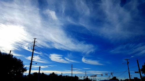 Low angle view of electricity pylon against sky