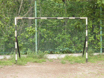 View of soccer field against trees