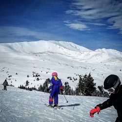 Full length of person skiing on snow covered mountain