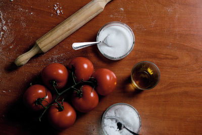 Preparing pizza base at home, we put tomato, cheese,...