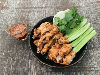 High angle view of meat in plate on table