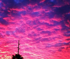 Low angle view of cloudy sky at sunset