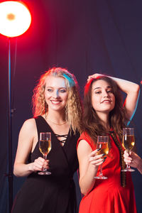 Beautiful young woman drinking glasses