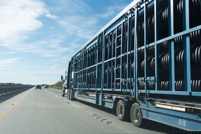 Cars on road against sky