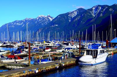 Boats moored at harbor