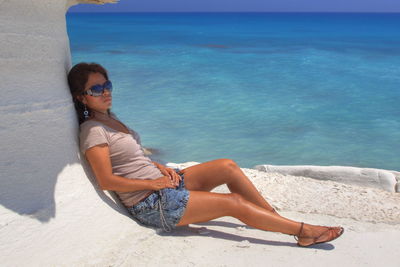 Woman sitting on beach