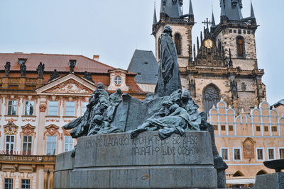 Statue of historic building against sky