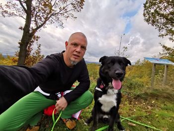 Portrait of man with dog