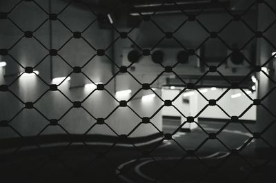 Full frame shot of chainlink fence at parking lot