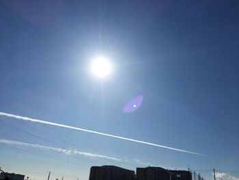 Low angle view of vapor trails in sky