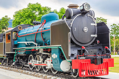 Train on railroad track against sky