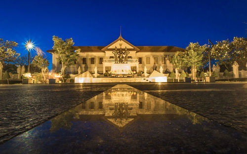 Reflection of building in water at night