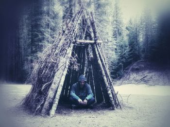 Man sitting in forest