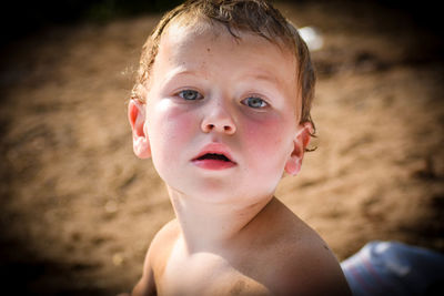 Close-up portrait of shirtless boy