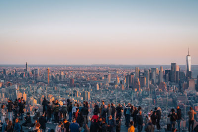 High angle view of cityscape against clear sky during sunset