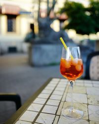 Aperitiv in glass standing on the table in outside cafe in berlin 