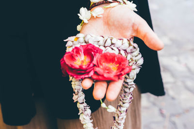 Close-up of woman holding flower