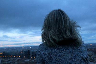 Rear view of  woman against sky