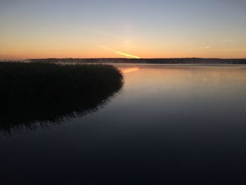 Scenic view of sunset over lake