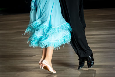 Low section of woman standing on floor