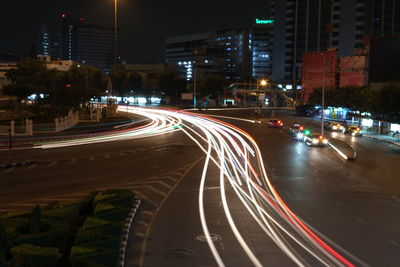 Light trails on road in city at night