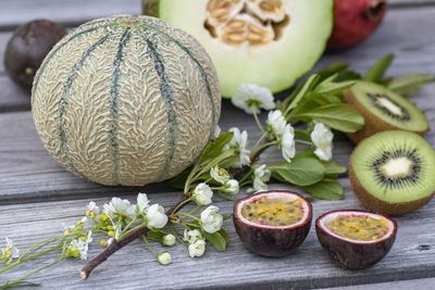 Close-up of fruits and leaves on table