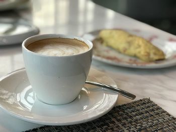 Close-up of coffee served on table