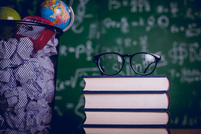 Close-up of eyeglasses on book