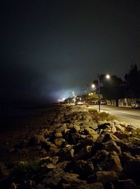 Scenic view of sea against sky at night