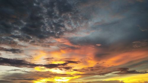 Low angle view of dramatic sky during sunset