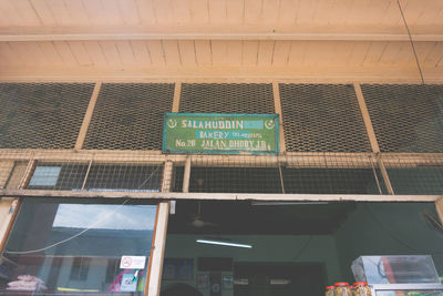 Low angle view of information sign on building