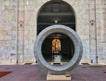 Buildings seen through arch door of building