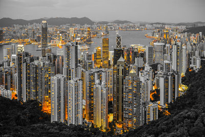 High angle view of modern buildings in city against sky