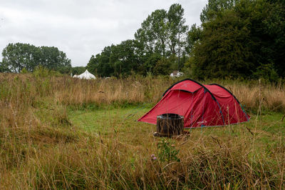Tent on field against sky
