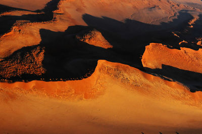 Scenic view of sand dunes in desert against sky