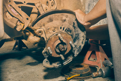 High angle view of man working on rusty metal