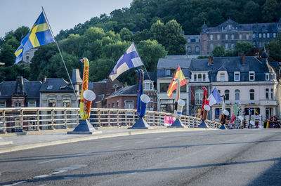 A row of colourful saxaphones on the bridge at dinant, birthplace of adolphe sax