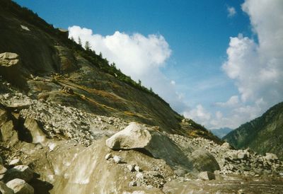 Scenic view of mountains against cloudy sky