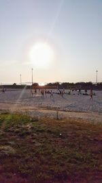 Scenic view of field against sky at sunset