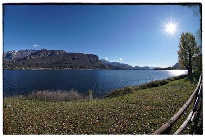 Scenic view of sea against clear blue sky