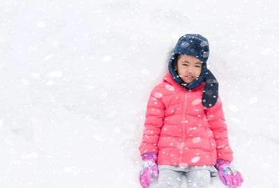 Full length of a girl standing in snow