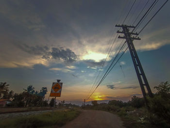 Low angle view of road against sky during sunset