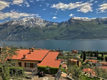 High angle view of buildings and mountains against sky