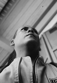 Low angle view of young man looking away