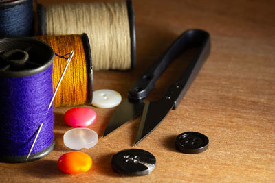 High angle view of multi colored spool on table