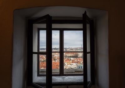 Buildings seen through window of house