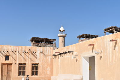 Low angle view of bell tower against clear sky