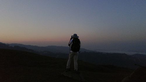 Woman standing on mountain landscape