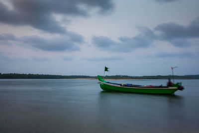 Boat in sea against sky