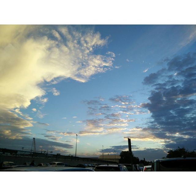 sky, transfer print, architecture, built structure, cloud - sky, connection, silhouette, auto post production filter, low angle view, cloudy, building exterior, cloud, bridge - man made structure, city, transportation, sunset, dusk, engineering, outdoors, street light